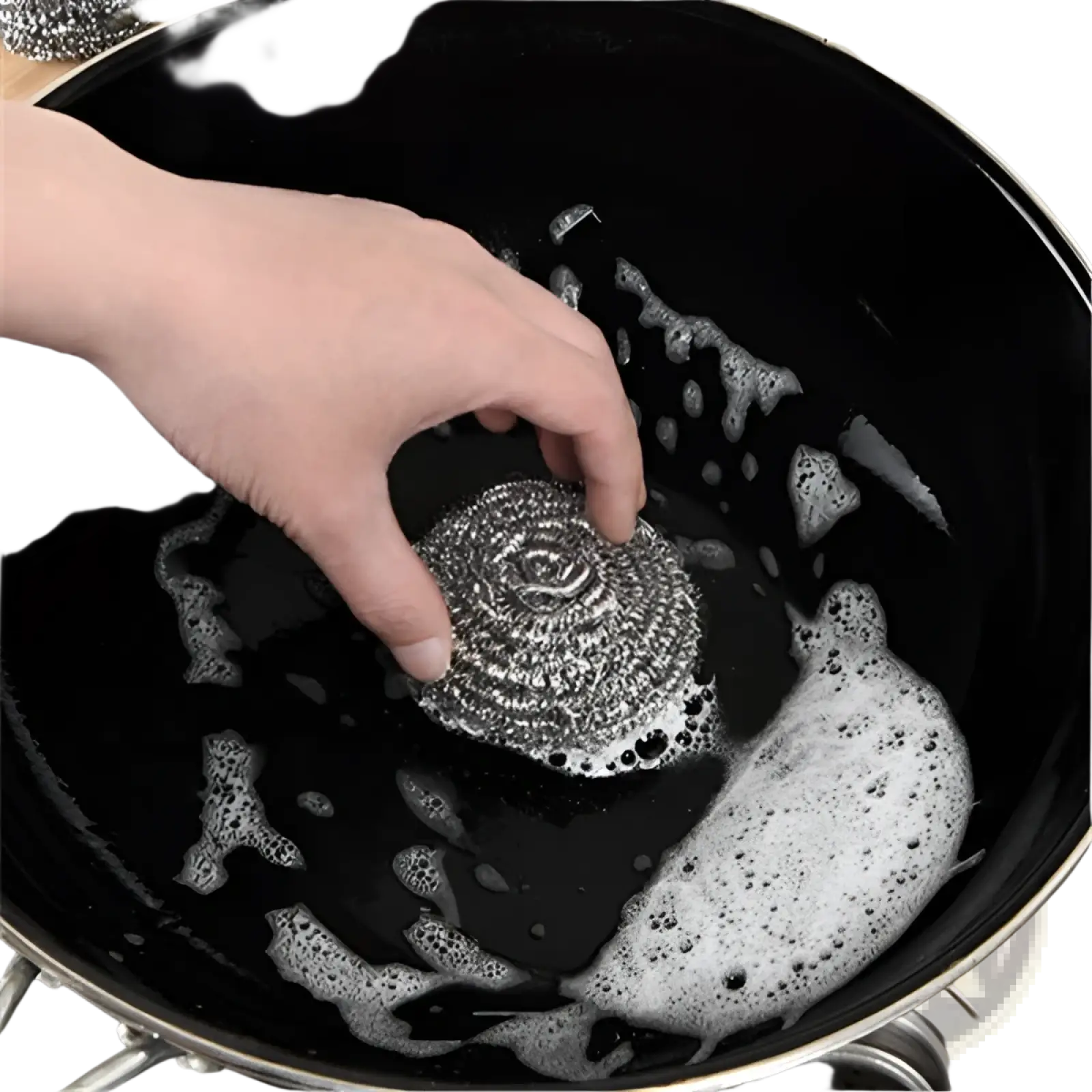 A metallic spiral-shaped steel wool nano emery sponge rust and stain remover tool held over a soapy black pot