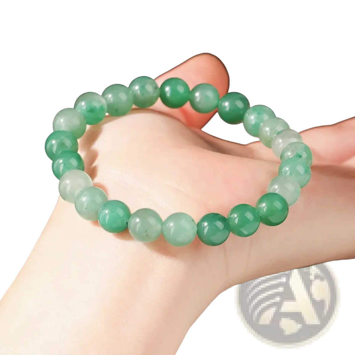 A delicate natural African jade bead bracelet with smooth green and translucent white gemstones unisex design
