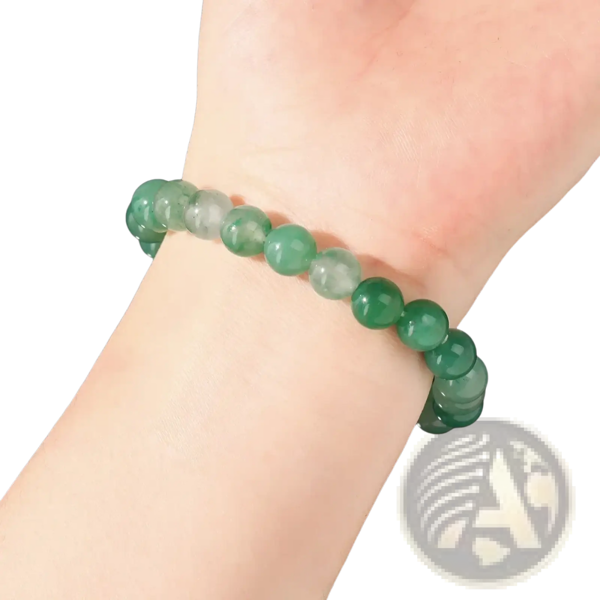 A delicate natural African jade bead bracelet featuring smooth green gemstones worn on a wrist
