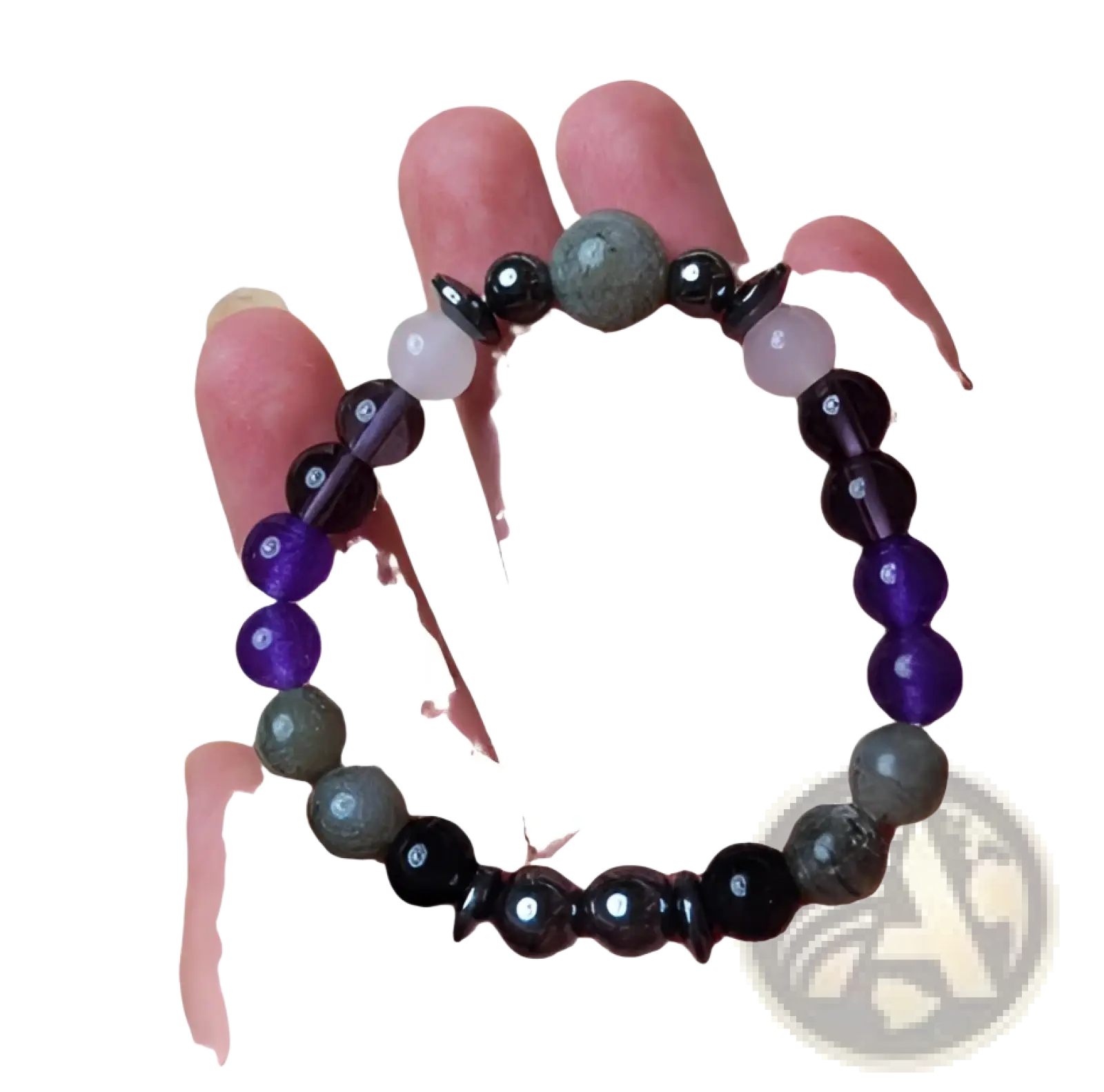 A handcrafted natural amethyst and magnetic stone beaded unisex bracelet with polished purple, black, and gray beads