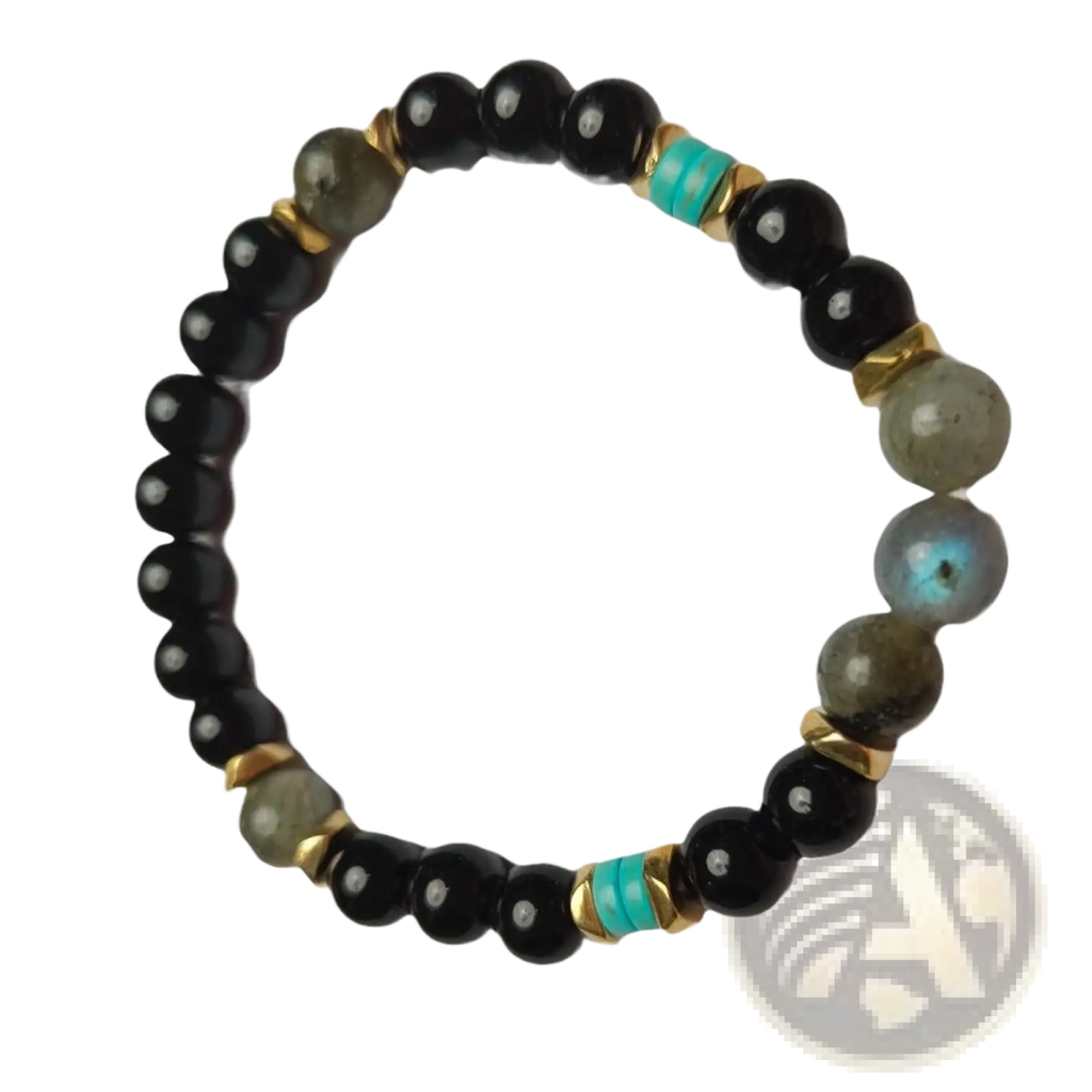 A stretchy unisex bracelet featuring black onyx and labradorite beads with turquoise spacers and gold metal connectors