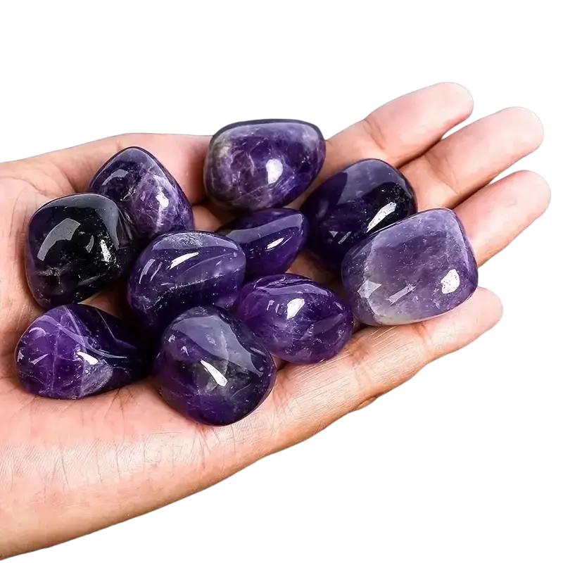 A hand holds natural amethyst tumbled stones 100g polished purple with smooth texture and natural inclusions for reiki healing