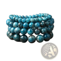 Stacked turquoise-blue aventurine bead bracelets with natural mineral patterns and polished round surfaces