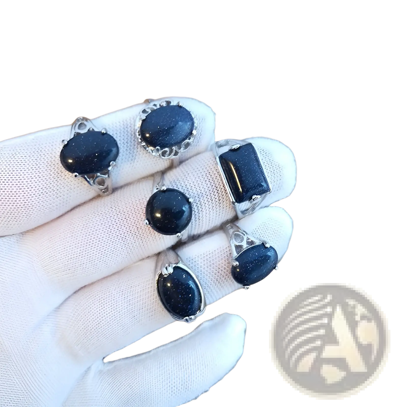 A collection of five silver tone rings featuring deep blue glittering natural gemstone oval and rectangular cuts