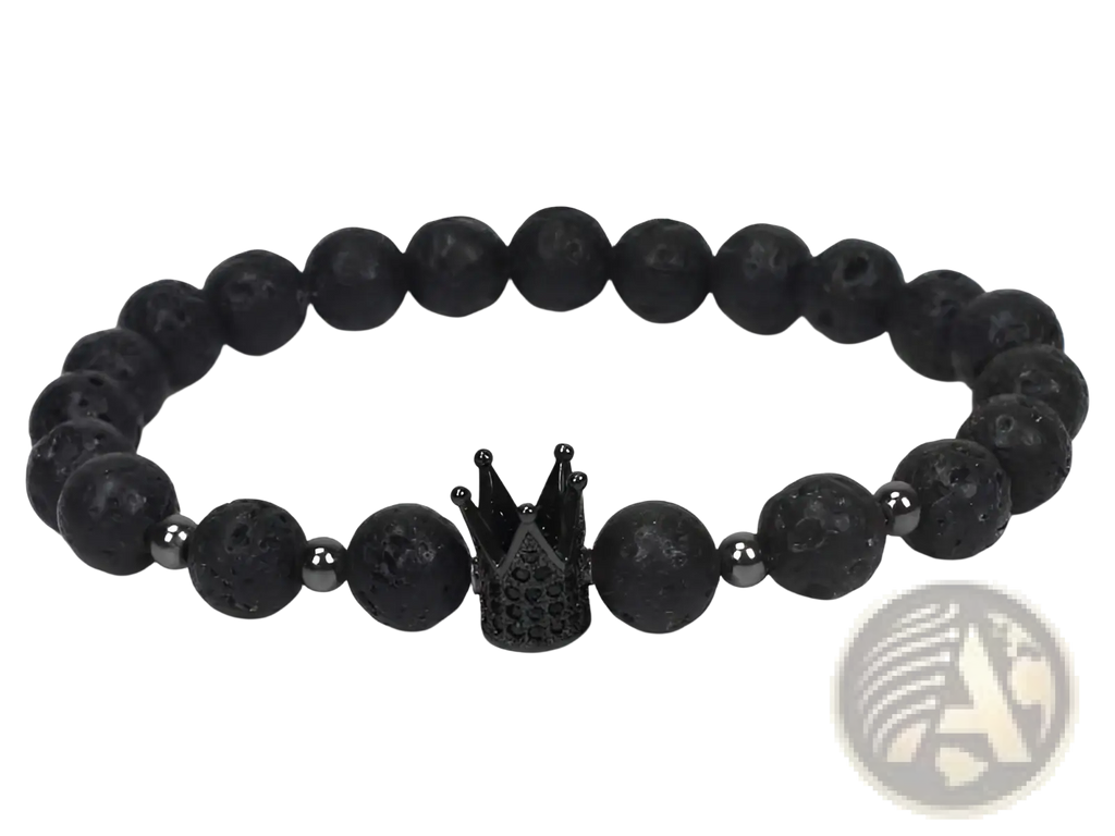 Black lava stone bracelet with central black crown charm featuring intricate detailing and natural lapis lazuli owl charm