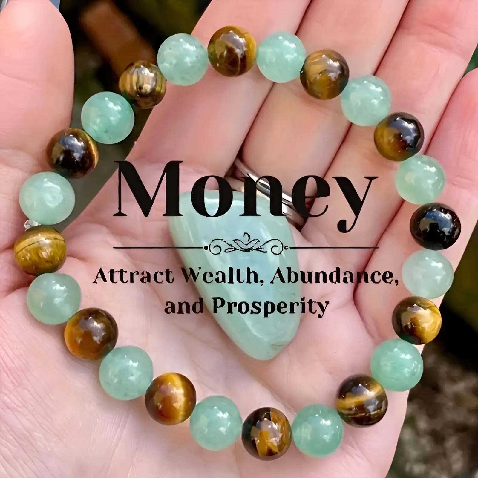 A hand holds a natural multi-gemstone beaded bracelet with light green jade and golden-brown tiger eye stones