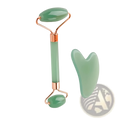 Natural resin jade roller and gua sha facial massage set in jade green with rose gold accents for skincare
