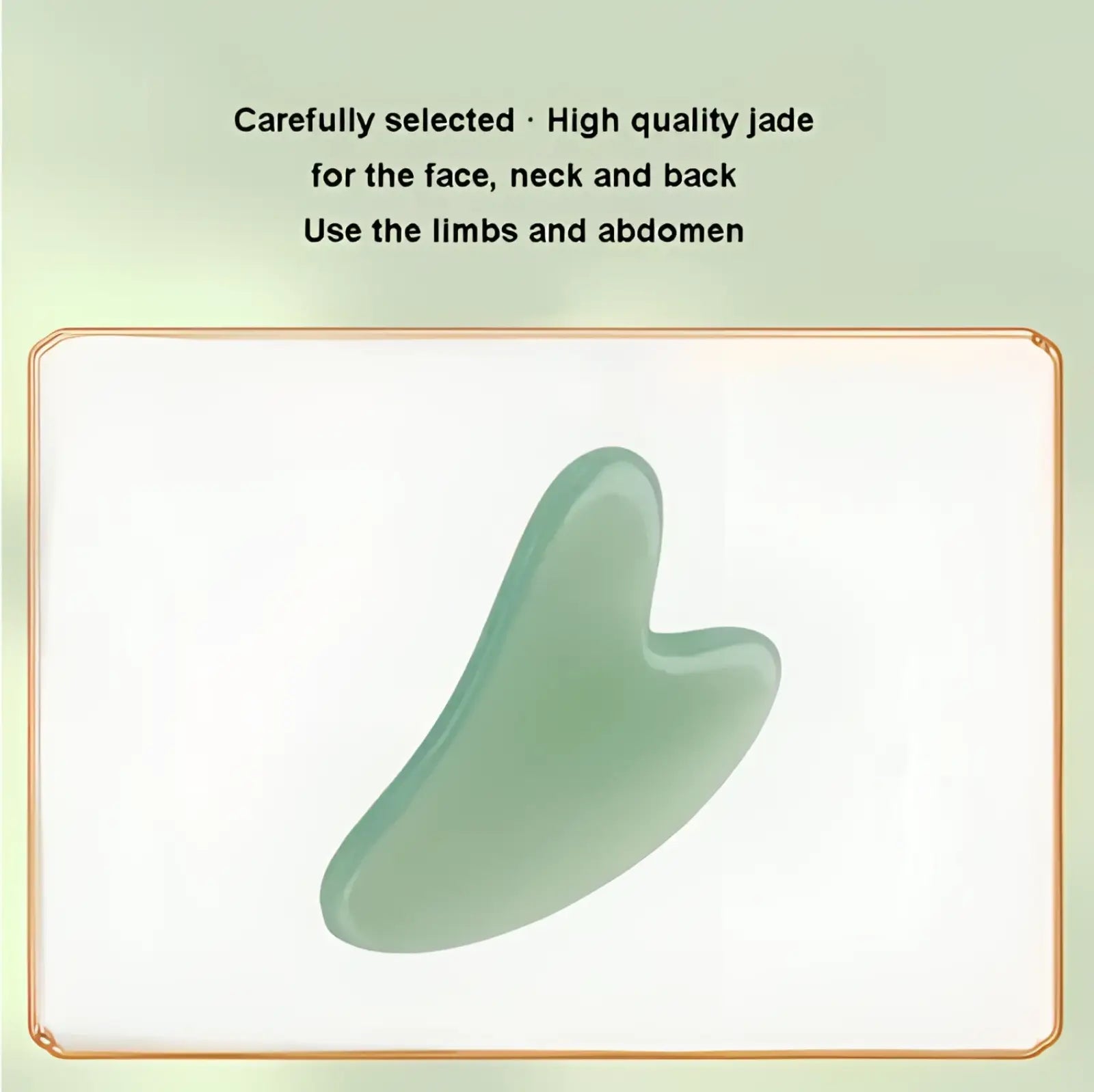 A smooth, translucent light green jade gua sha facial massage tool made of natural resin with a heart-shaped design
