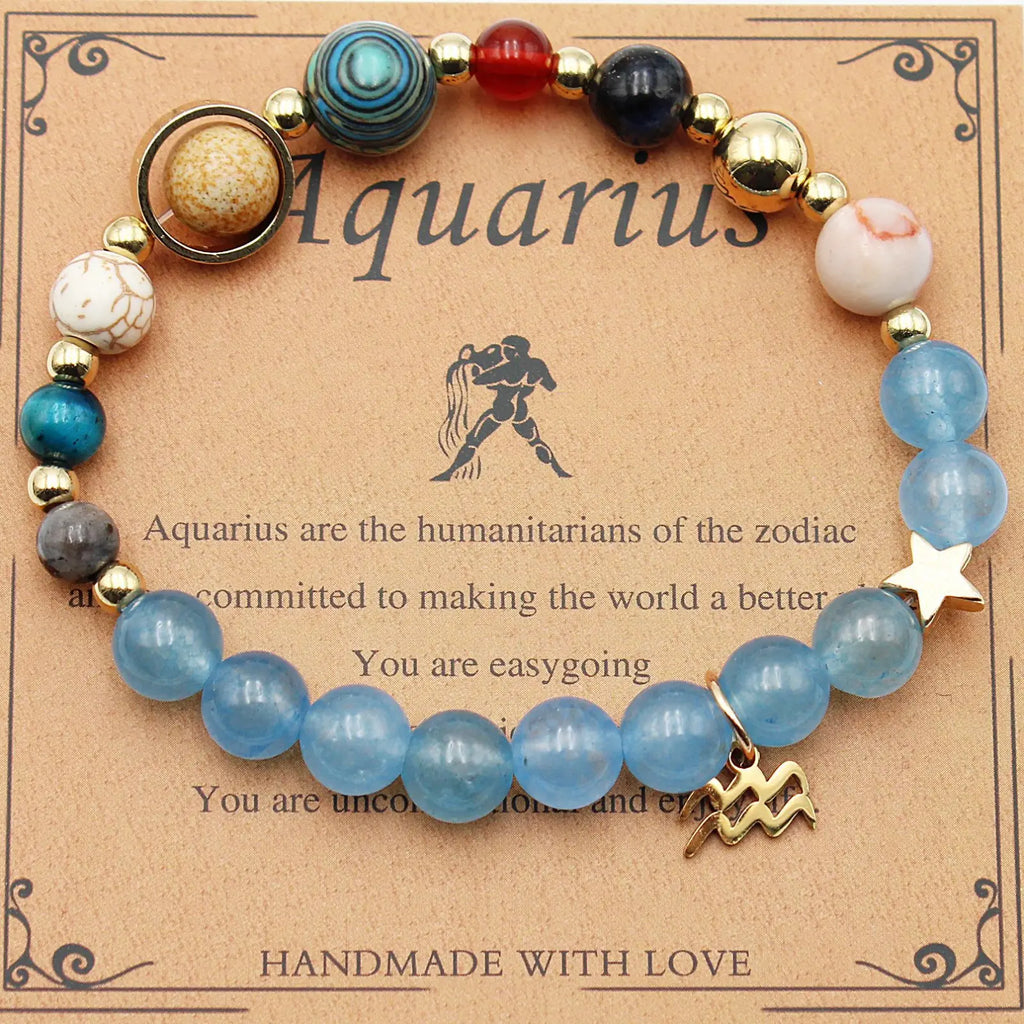Handmade aquarius zodiac bracelet with translucent blue beads and gold-toned star charm from natural stone twelve zodiac set