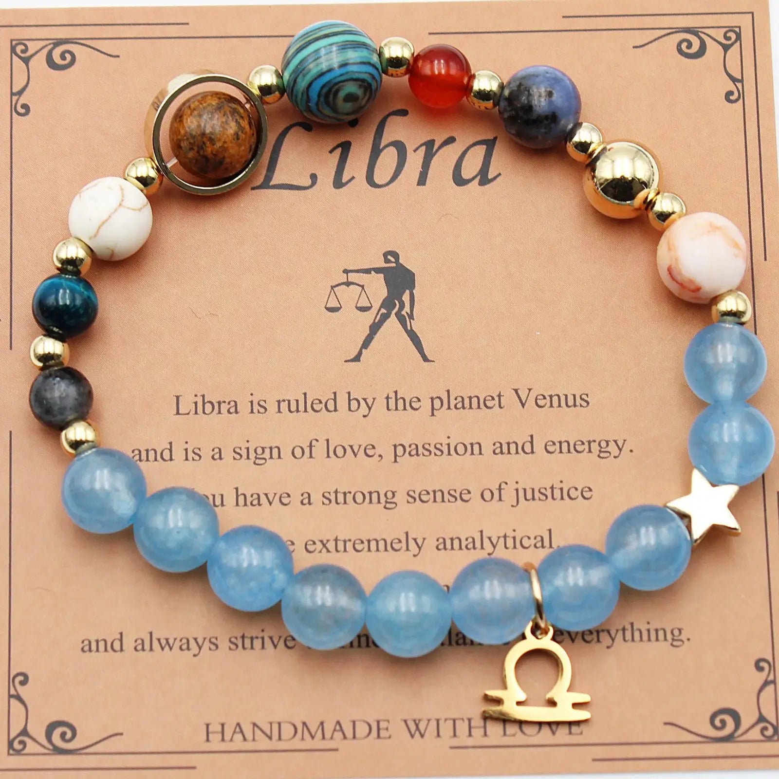 A libra zodiac natural stone beaded bracelet with blue white gold and red stones and a golden scale charm