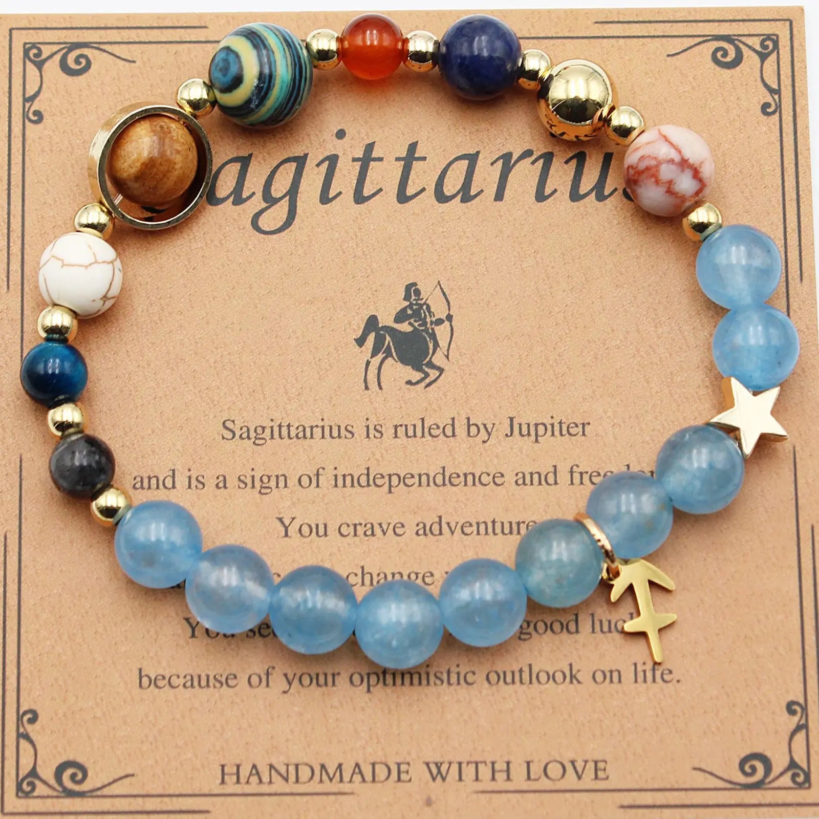 Handmade Sagittarius zodiac bracelet with blue white and gold beads and a star charm in natural stone twelve zodiac constellation style