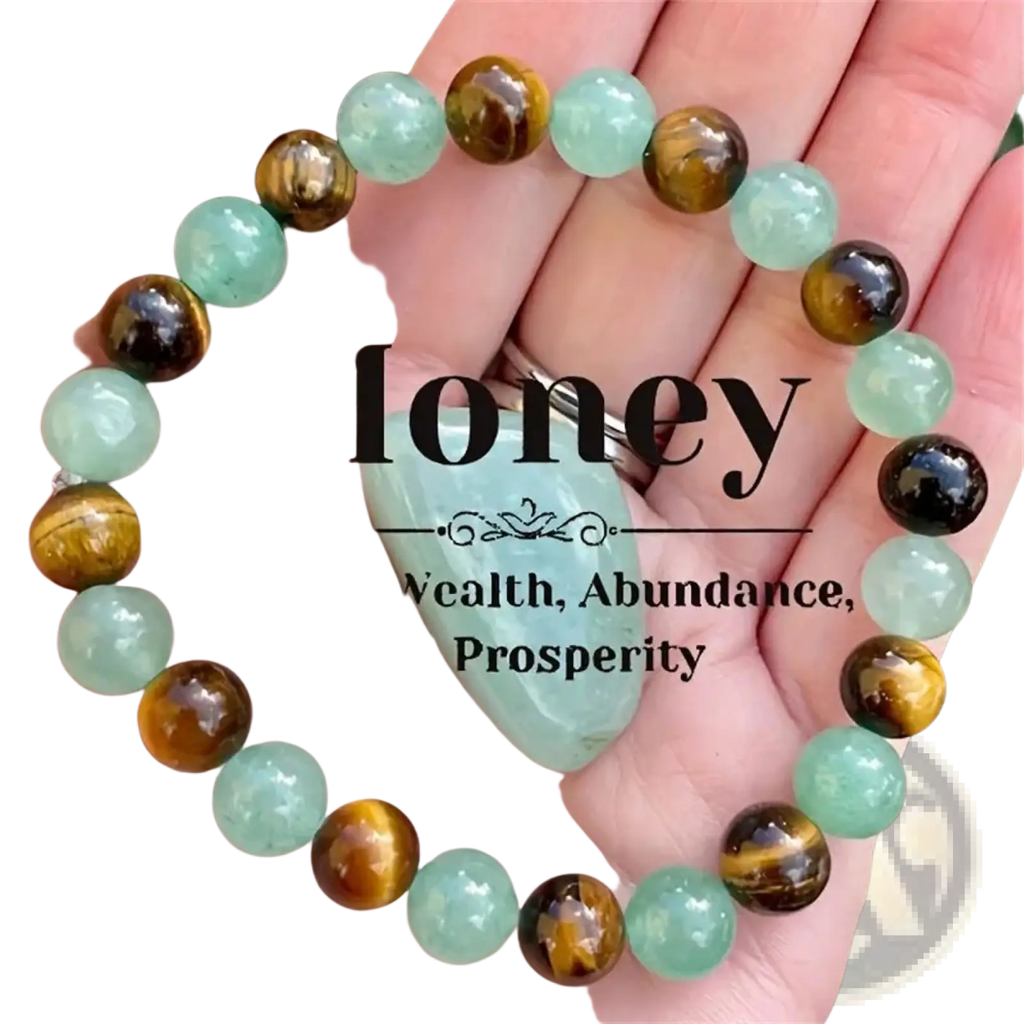 A hand holds a natural tiger eye and green aventurine beaded bracelet with translucent green and golden stones
