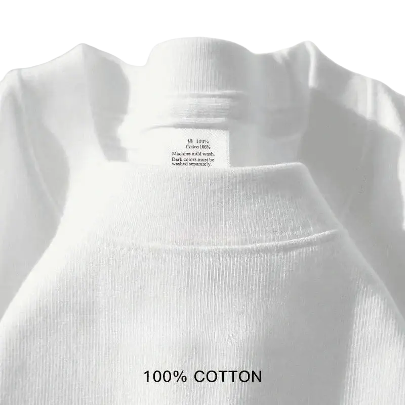 White ribbed cotton turtleneck sweater paired with navy blue cotton round neck t shirt showcasing minimalist design