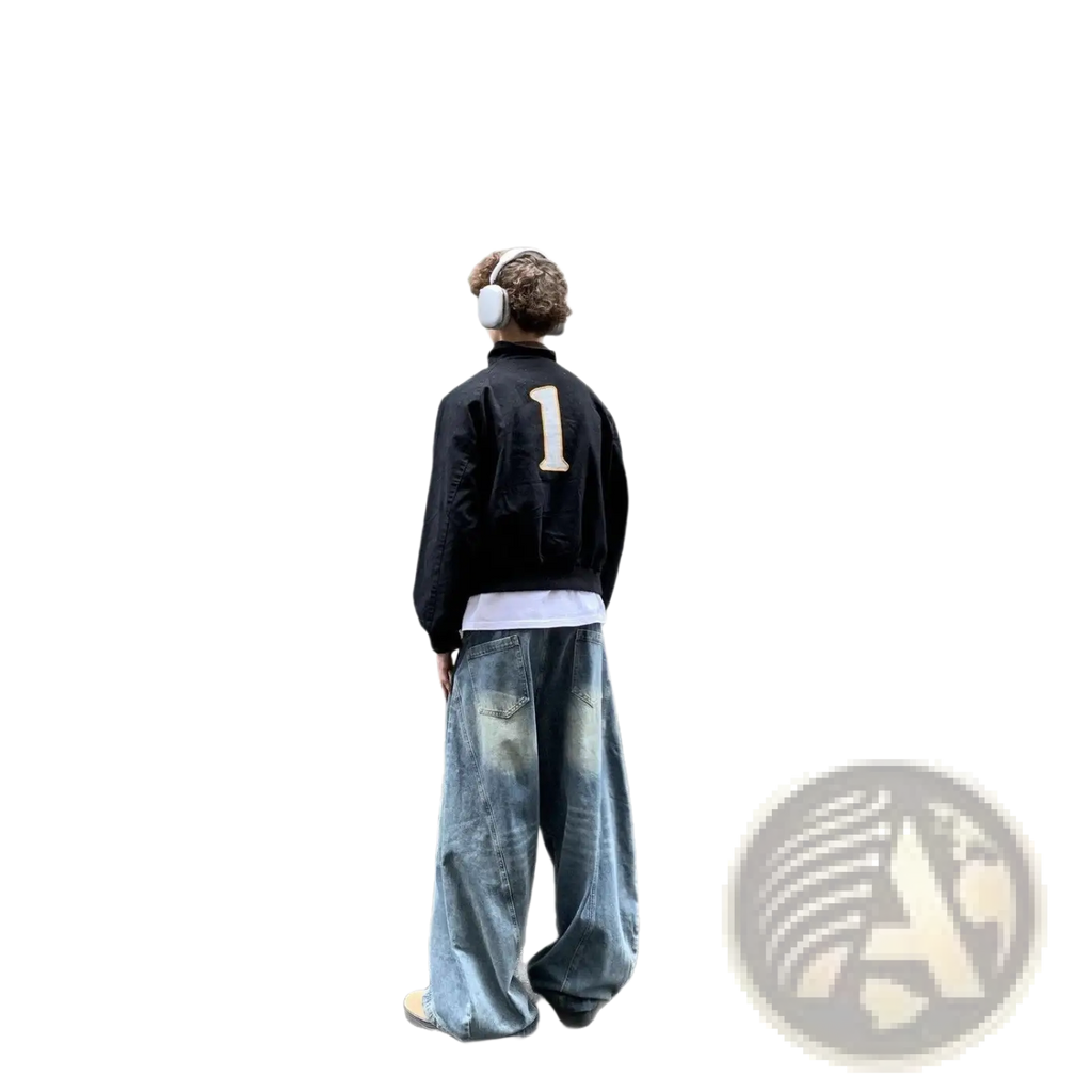 Image of the back side of a black bomber jacket featuring a beige number one patch, paired with a navy blue cropped baseball jacket with fur collar