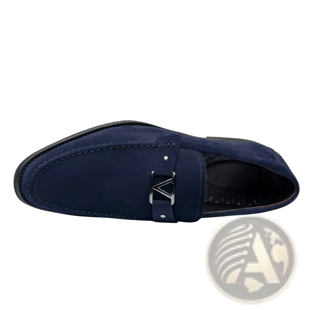 Navy blue suede buckle loafers with a silver triangular buckle and non slip rubber soles shown from the back side