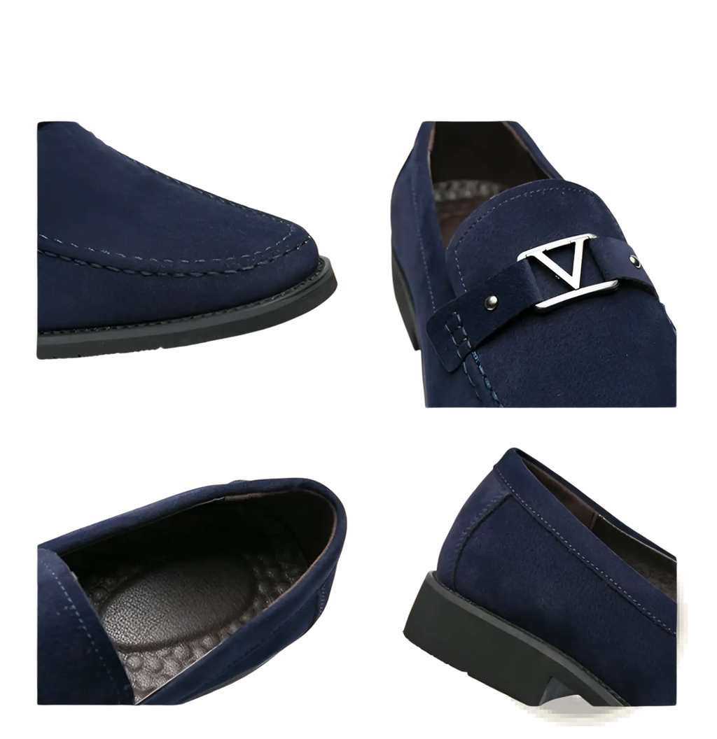 Navy blue suede loafers with silver-tone triangular buckle and non slip rubber soles shown from the back side