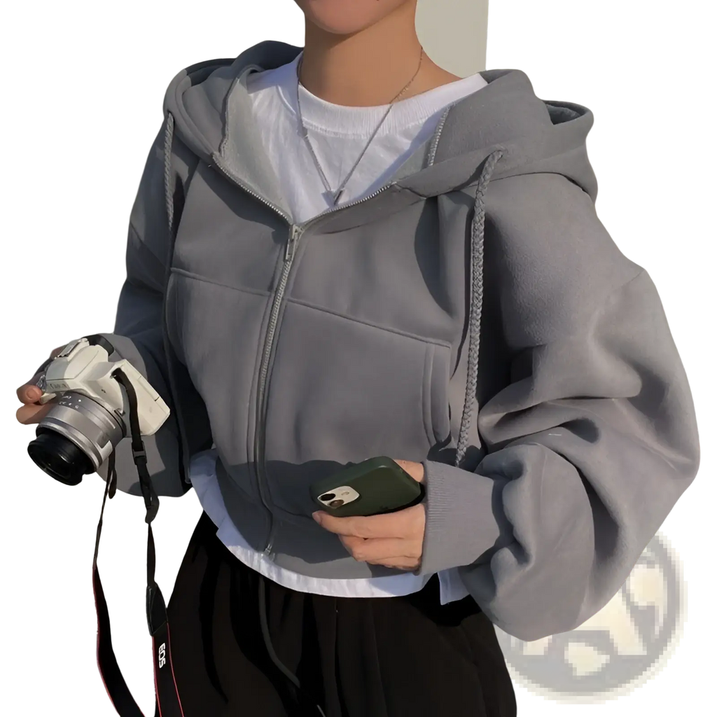 Gray zip-up hoodie with a soft textured fabric and drawstring hood paired with navy blue velvet padded slim fit sweater