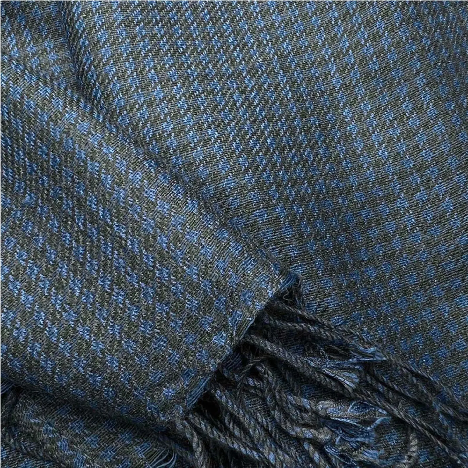 Navy jacquard herringbone scarf made of dark blue and gray wool with a textured weave and fringed edges