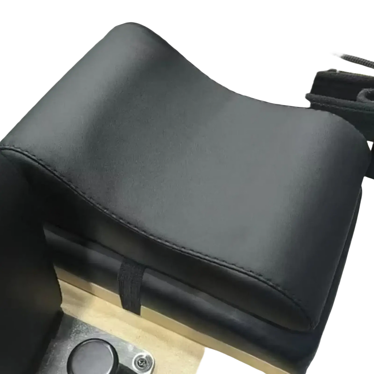 Black leather neck support pillow with stitched edges and contoured design for Pilates reformer use