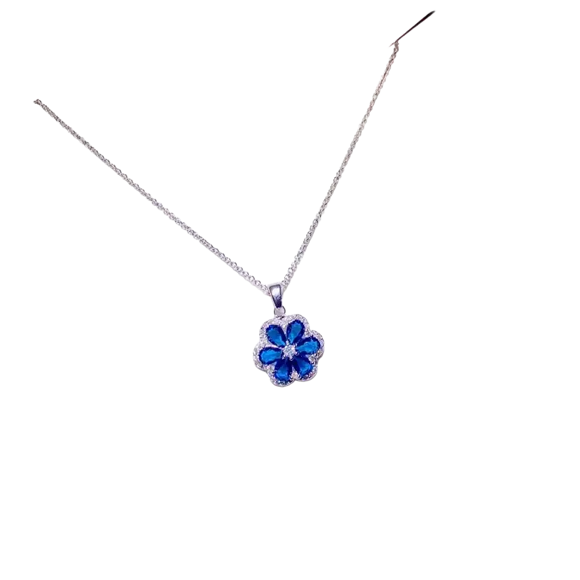 A delicate silver chain necklace pendant featuring a vibrant blue created sapphire flower with clear stones fine jewelry