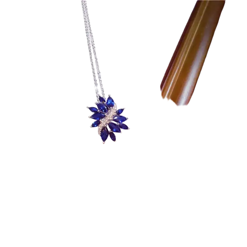 A silver chain necklace pendant featuring a created sapphire blue open flower with sparkling accents fine jewelry