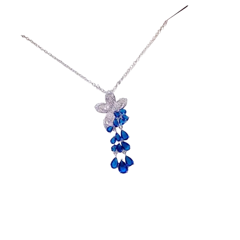Delicate silver necklace pendant featuring created sapphire blue teardrops and sparkling white stones fine jewelry