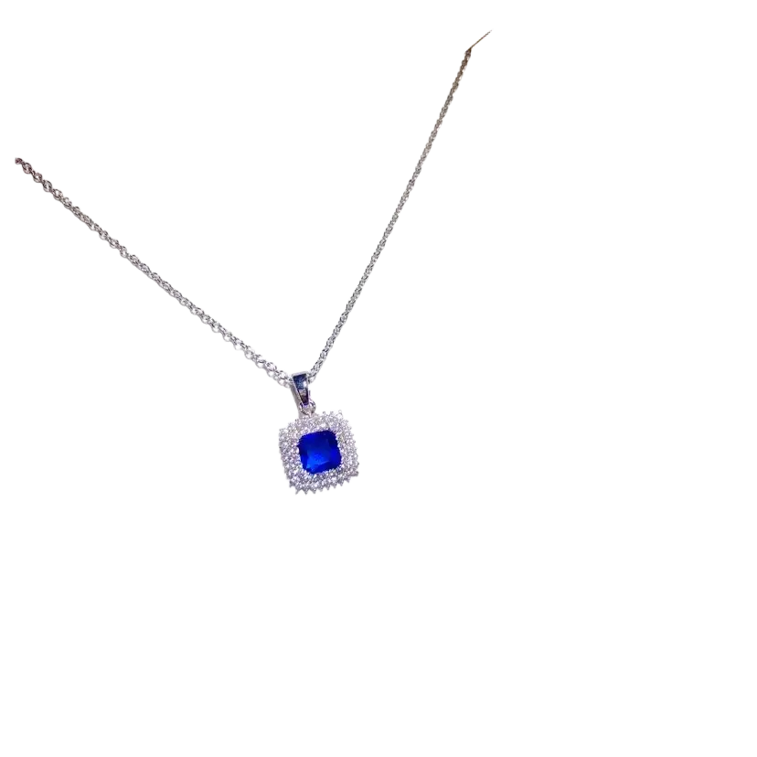 A delicate silver necklace pendant featuring a square created sapphire surrounded by clear stones fine jewelry