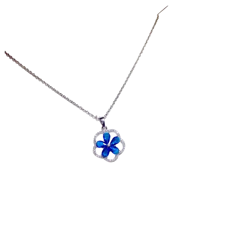 A delicate silver chain necklace pendant featuring a created sapphire blue flower encircled by clear stones fine jewelry
