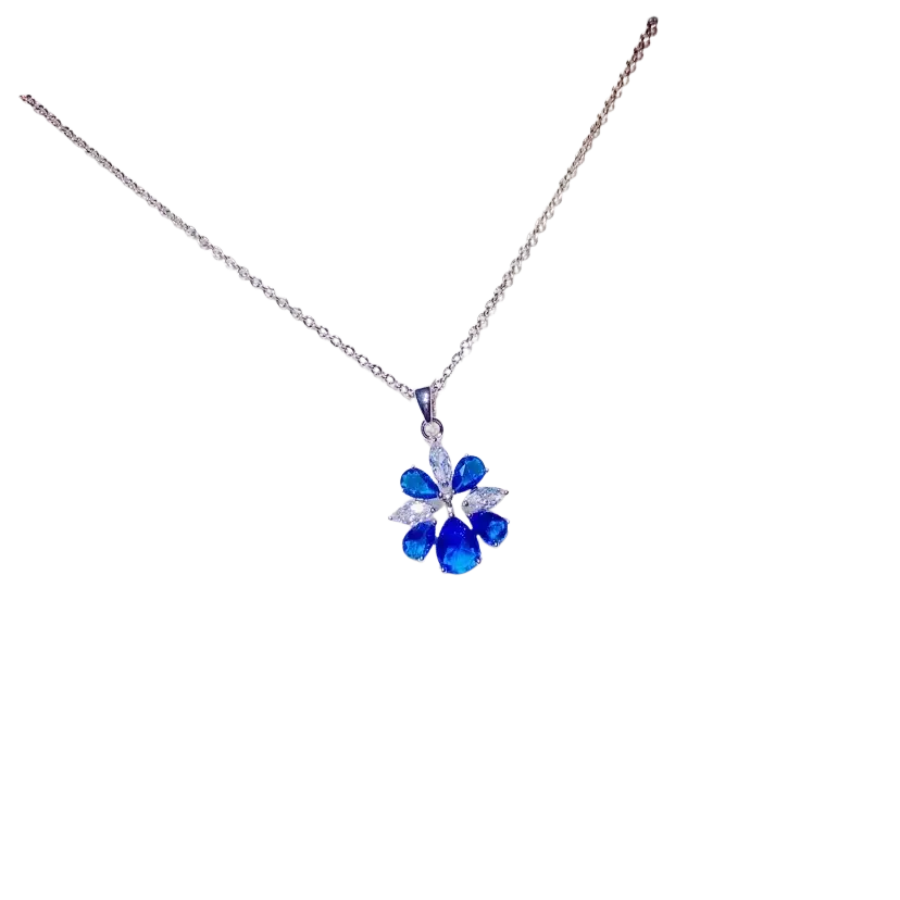 A delicate silver chain necklace pendant featuring a vibrant blue created sapphire flower with clear stones fine jewelry