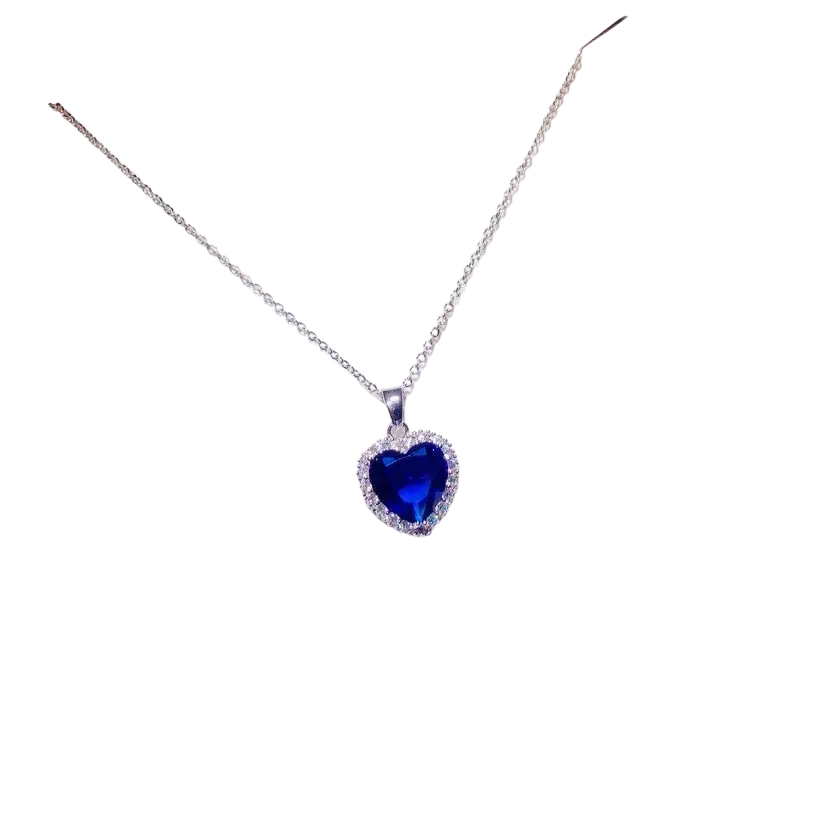 A delicate silver necklace pendant with a heart-shaped created sapphire surrounded by clear stones fine jewelry