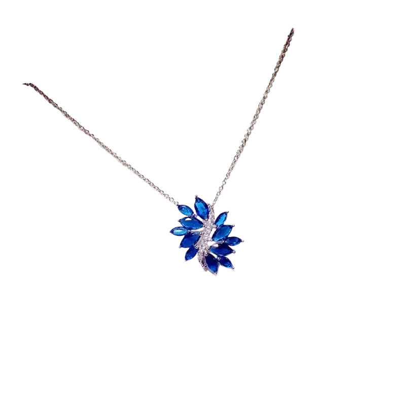 A delicate silver chain necklace pendant featuring a blue created sapphire leaf with sparkling clear stones fine jewelry