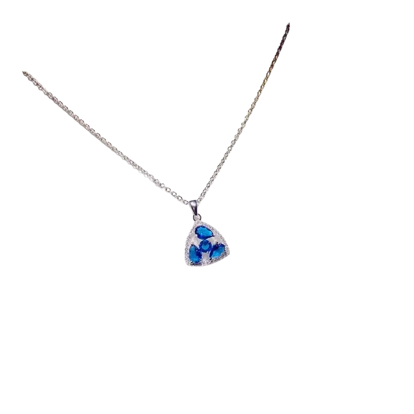 A silver chain necklace pendant with a triangular created sapphire and clear crystal accents in fine jewelry design