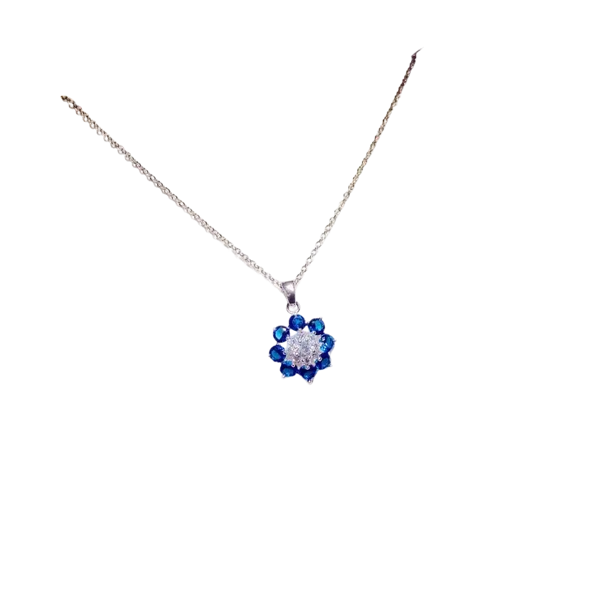 A delicate silver chain necklace pendant with blue and clear created sapphire crystals in fine jewelry design