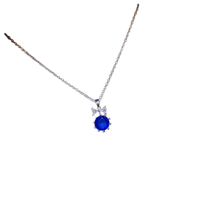 Delicate silver necklace pendant with butterfly design featuring sparkling stones and a created sapphire center