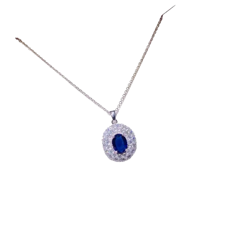 Elegant silver necklace pendant featuring a created sapphire oval gemstone surrounded by clear crystals fine jewelry