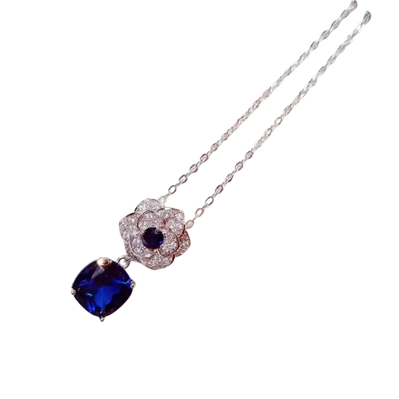 Elegant silver necklace pendant featuring created sapphire deep blue gemstones and sparkling diamond accents fine jewelry