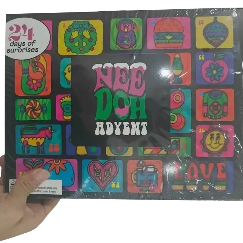 A colorful black nee doh halloween advent calendar with 24 vibrant cartoon squishy toy designs including peace sign wreath and burger