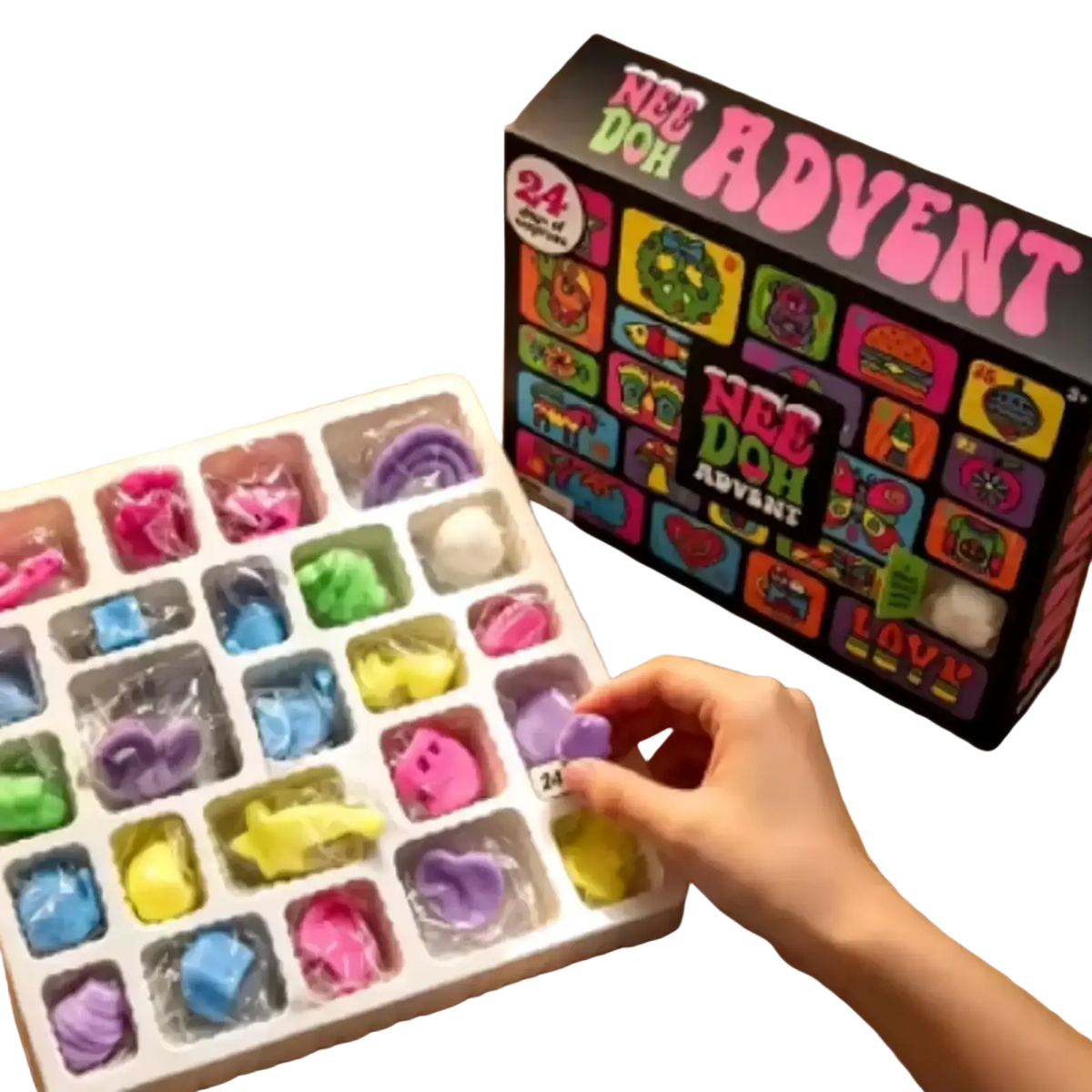 A hand reaches for a purple sculpted sensory toy from the colorful needoh advent calendar 24day set