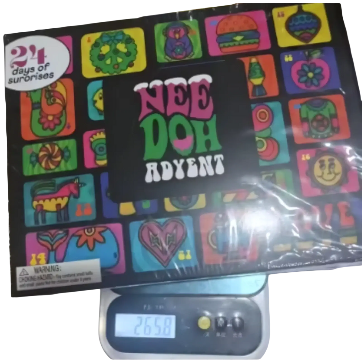 The needoh advent calendar 24-day sensory toy set box features a black surface with vibrant colorful cartoon illustrations