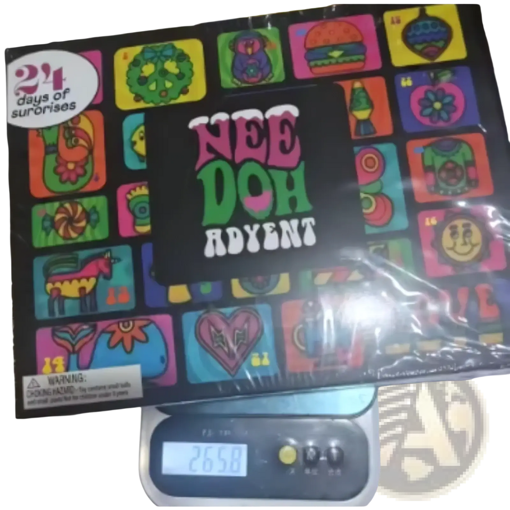 The needoh advent calendar 24-day sensory toy set box features a black surface with vibrant colorful cartoon illustrations