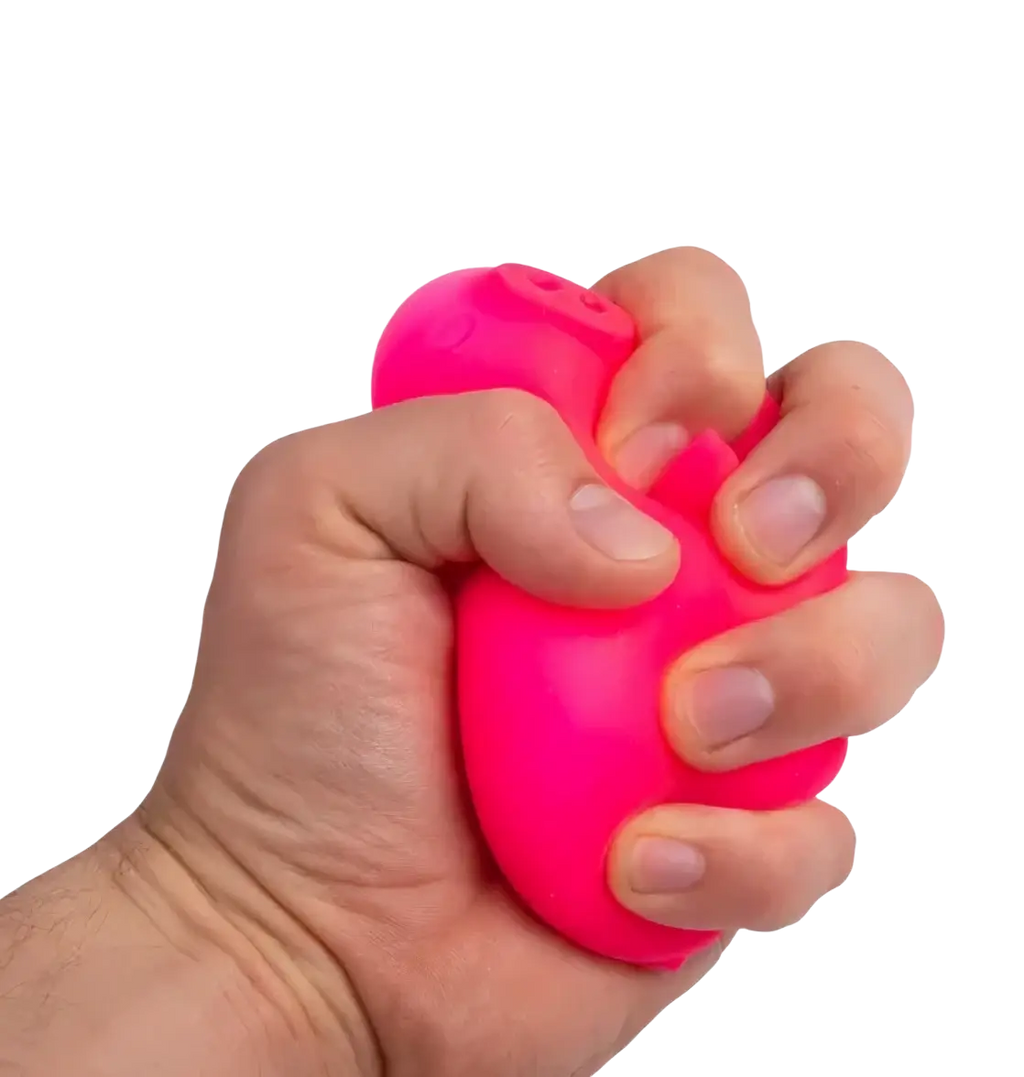 A bright pink needoh digging pig sensory fidget toy with a smooth glossy surface and squishy texture