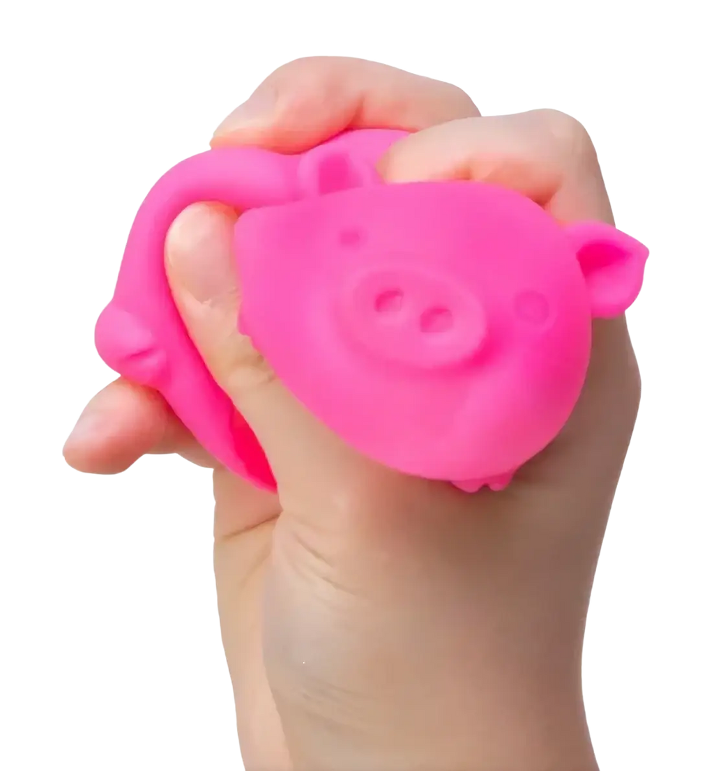 A bright pink silicone needoh digging pig sensory fidget toy designed as a squishy stress reliever