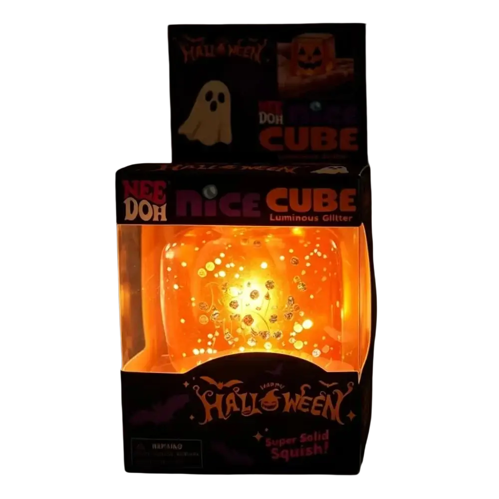 Orange luminous glitter needoh squishy sensory fidget toy cube in a halloween-themed box for sensory play