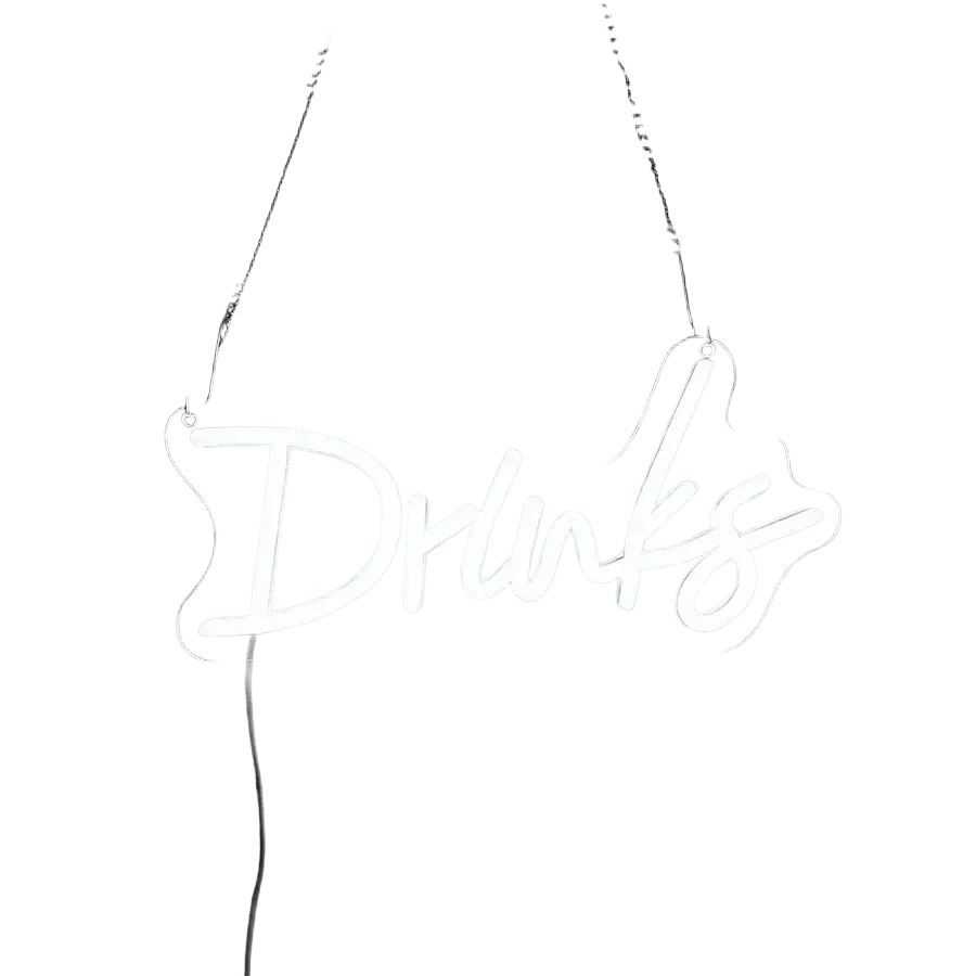 A glowing white neon sign with the word drinks in cursive led script suspended by chains on a dark wall