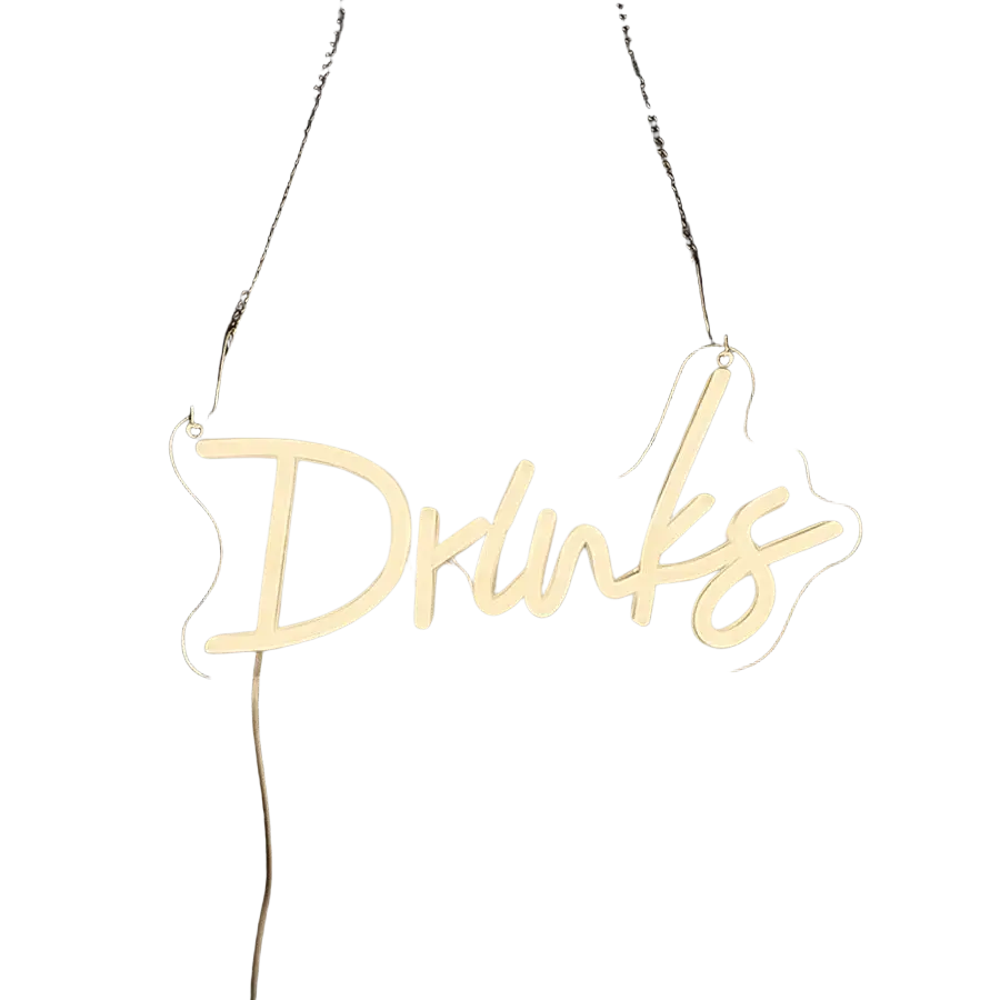 A glowing white neon sign shaped like the word drinks hangs on a dark tiled wall for led wall decor