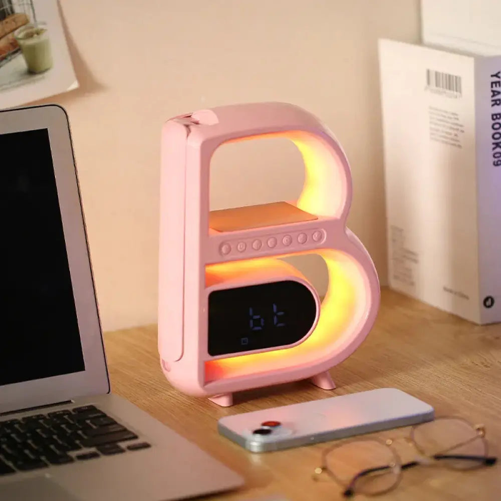 Smart b-shaped rgb bluetooth speaker and wireless charger in pink with letter-shaped alarm clock and glowing led lights