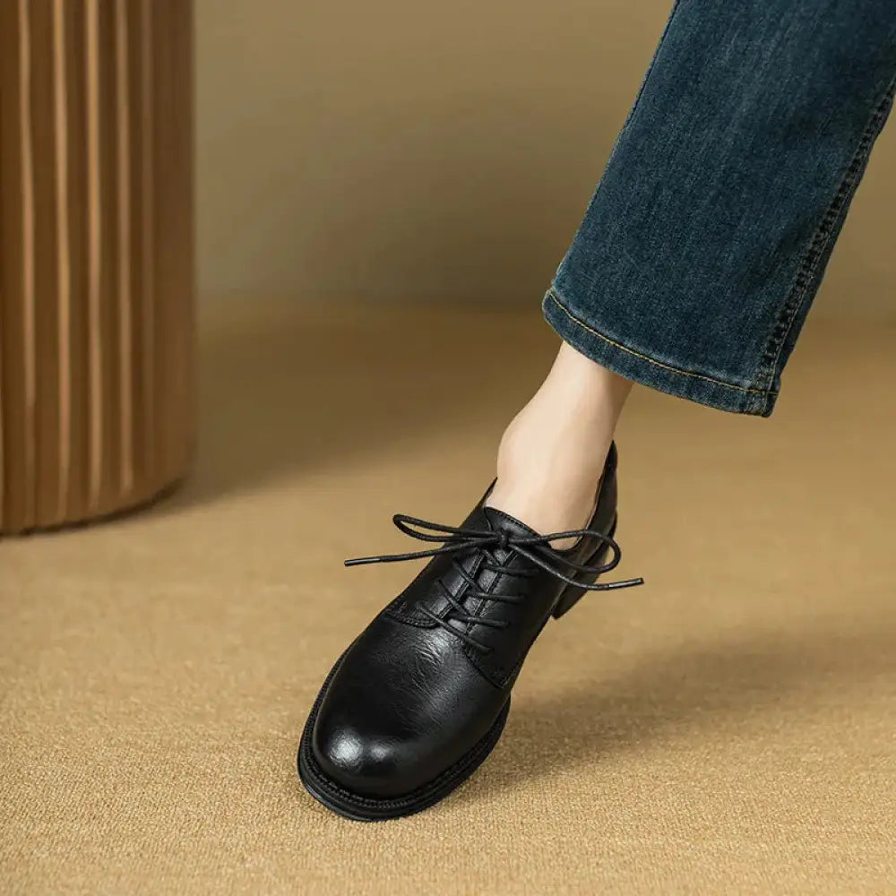 Black leather lace-up women’s British leather round toe oxford shoe with low heel and rounded toe