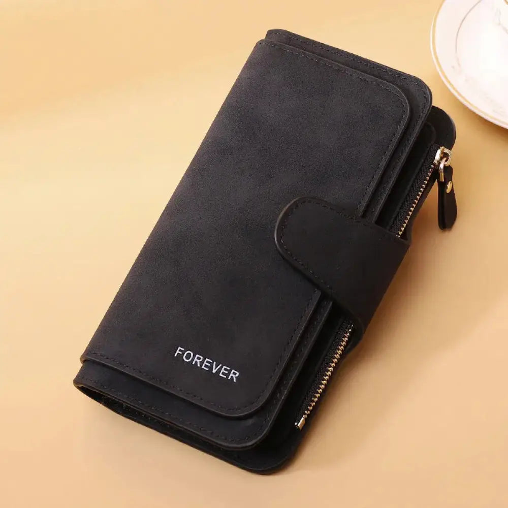 Black suede women’s trifold buckle wallet with forever embroidered in silver thread and zipper closure