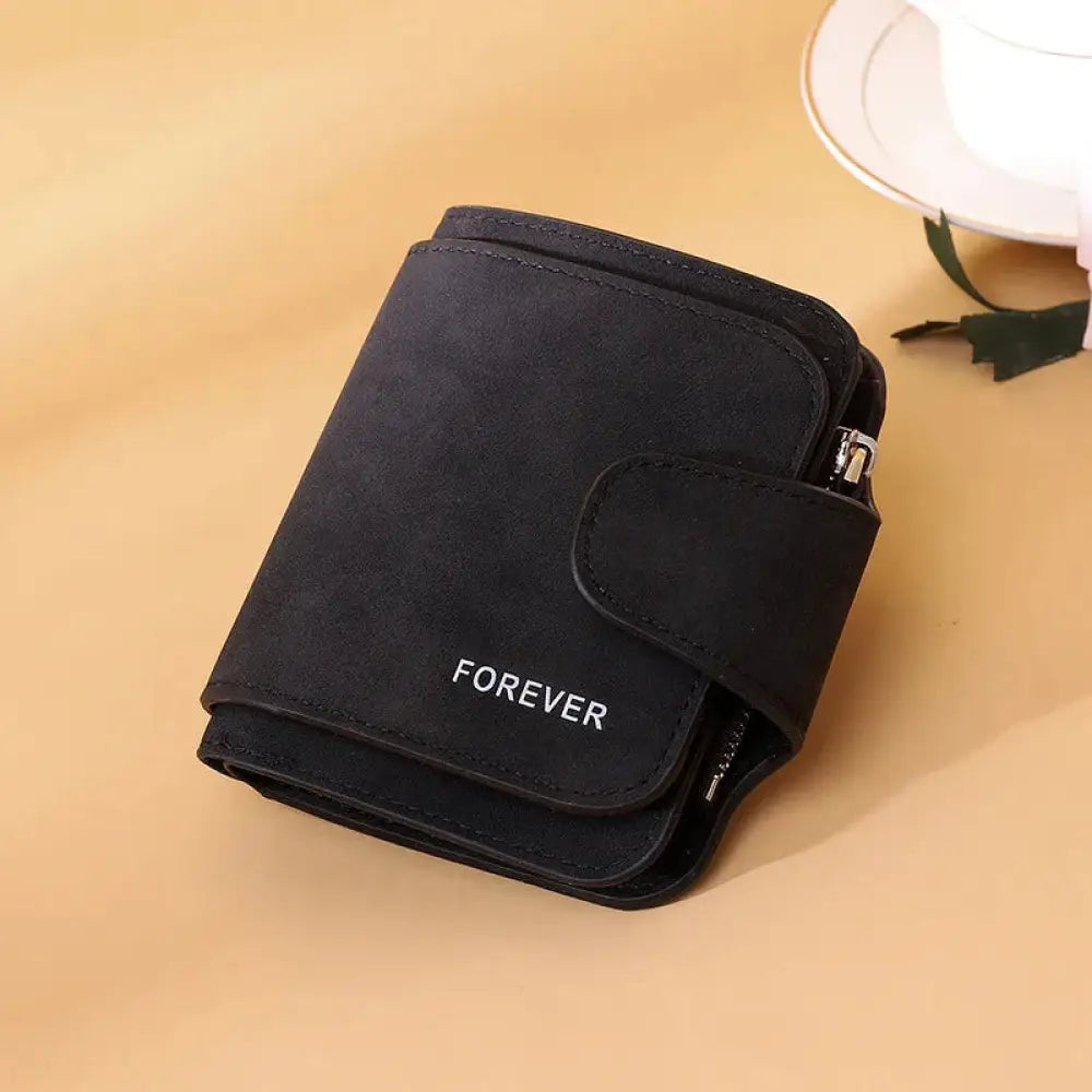 Black suede trifold buckle wallet for women with forever embroidered in white on the front side