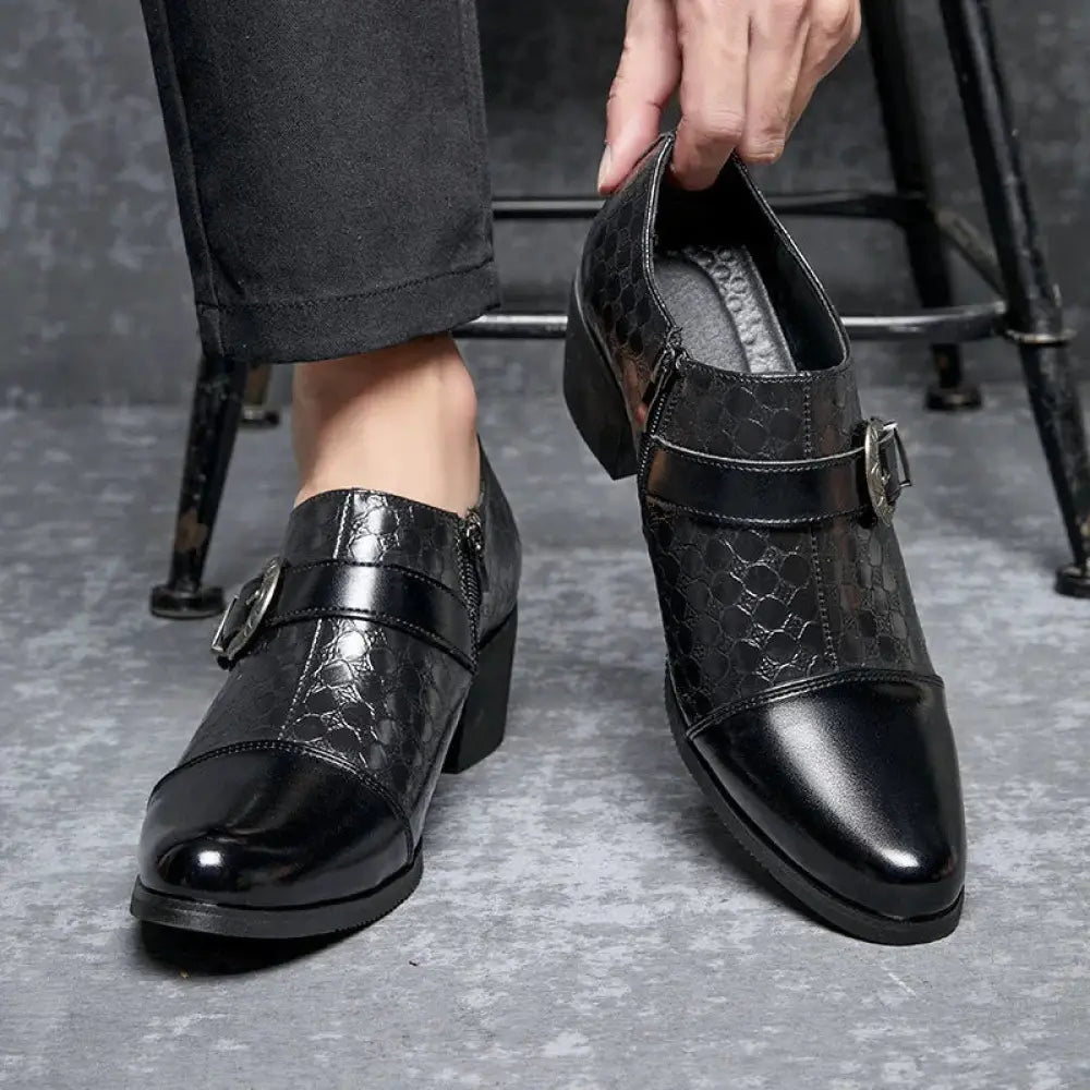 Men’s black crocodile pattern leather dress shoes with a glossy finish and single buckle strap across the instep